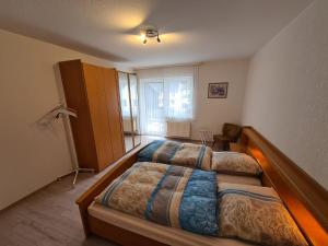 a bedroom with two beds and a window at Domizil in Bad Bertrich