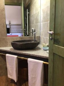 a bathroom with a sink and towels on a counter at la Pepi house 2 in Arcones