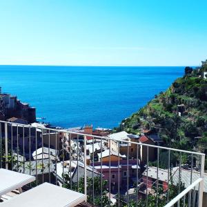a view of the ocean from a building at Olimpo Affittacamere in Manarola