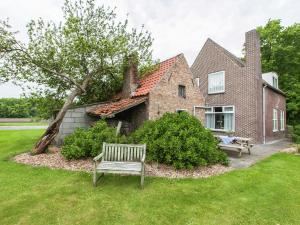 a bench in the yard of a house at from the Zealand coast and 20km from Brugge in Aardenburg