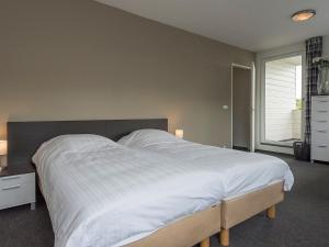 Postel nebo postele na pokoji v ubytování Luxury villa in Harderwijk with garden