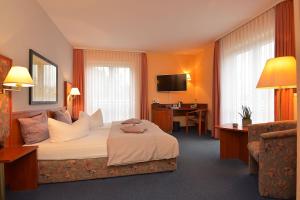 TV a/nebo společenská místnost v ubytování AltstadtHotel an der Werra