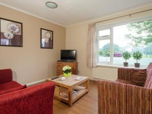 A seating area at Quietly located holiday home in Emst with enclosed garden