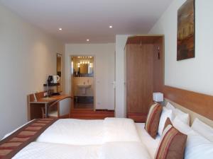 Postel nebo postele na pokoji v ubytování Boutique Hotel Wolfsburg + 37 fotografií