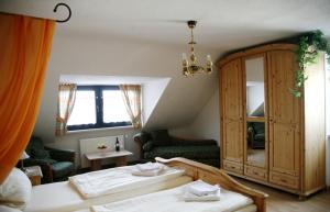 a bedroom with two beds and a large window at Hotel Am Markt in Kleinblittersdorf