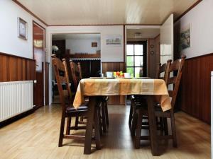a dining room with a table and chairs at Tranquil Farmhouse near Forest in Ulicoten with Terrace in Ulicoten