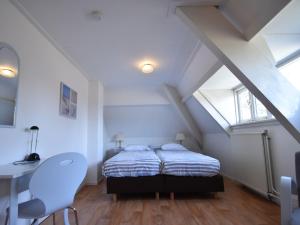 Postel nebo postele na pokoji v ubytování Holiday Home Bergen near Beach & Dunes