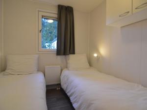 Ένα ή περισσότερα κρεβάτια σε δωμάτιο στο Cosy Chalet w Garden Patio +32 φωτογραφίες
