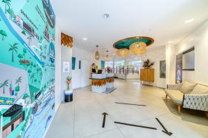 a lobby of a hospital with a mural on the wall at Résidence Santa Apolonia in Saint-Leu