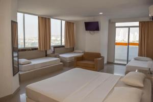 Postel nebo postele na pokoji v ubytování Hotel Cartagena Premium