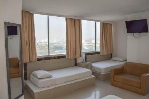 Postel nebo postele na pokoji v ubytování Hotel Cartagena Premium