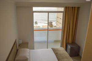 Postel nebo postele na pokoji v ubytování Hotel Cartagena Premium
