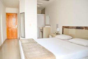 Postel nebo postele na pokoji v ubytování Hotel Cartagena Premium
