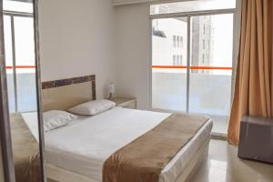 Postel nebo postele na pokoji v ubytování Hotel Cartagena Premium