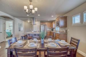 a dining room and kitchen with a table and chairs at East Bend Beauty in Bend