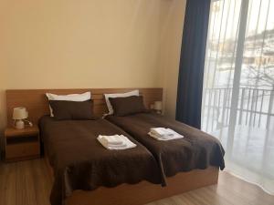 Letto o letti in una camera di Hotel Horizon Kazbegi