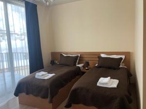 Letto o letti in una camera di Hotel Horizon Kazbegi