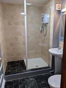 Een badkamer bij Sparkford Inn