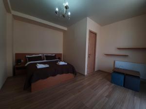 Letto o letti in una camera di Hotel Horizon Kazbegi