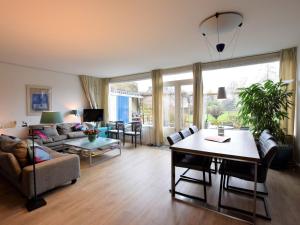 a living room with a couch and a table at Elzendreef in Voorburg