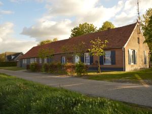 a house on the side of a road at Holiday home in North Limburg with enclosed garden in Ospel