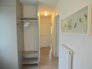 a hallway with a walk in closet and a mirror at Forest Retreat Near Kempen-Broek in De Horst +31 photos