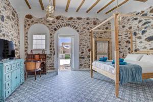 Postel nebo postele na pokoji v ubytování La Caldereta Rural Home + 36 fotografií