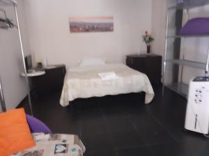 Posteľ alebo postele v izbe v ubytovaní Romeo and Juliet Apartaments