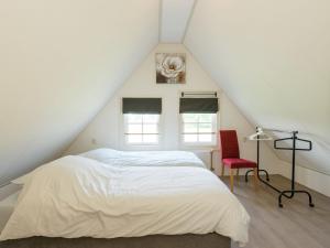 Ένα ή περισσότερα κρεβάτια σε δωμάτιο στο Holiday home on former island Wieringen