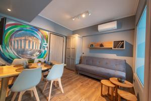 a living room with a table and a couch at Rooftop apartment in the center of Athens in Athens