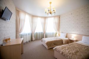 En eller flere senge i et værelse på Гостевой дом "Ламберт"