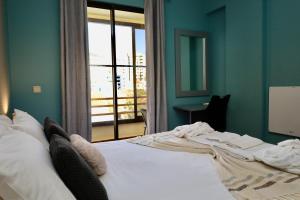 a large bed in a room with a window at Our Dream Downtown Experience by AnaLodges in Funchal +30 photos