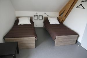 Postelja oz. postelje v sobi nastanitve Auberge Saint Jacques