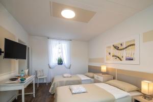 Rúm í herbergi á Albergo Ristorante Stazione Balerna