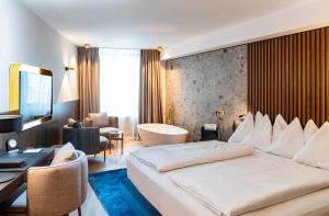 Ein Bett oder Betten in einem Zimmer der Unterkunft Hotel Innsbruck