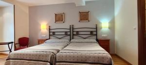 Postel nebo postele na pokoji v ubytování Hotel Rural la Plaza