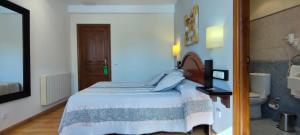 Postel nebo postele na pokoji v ubytování Hotel Rural la Plaza