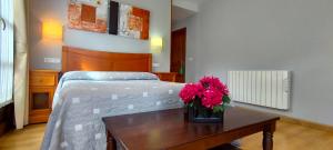 Postel nebo postele na pokoji v ubytování Hotel Rural la Plaza