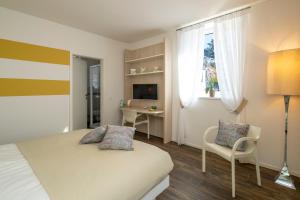 Rúm í herbergi á Albergo Ristorante Stazione Balerna