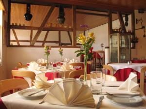 a dining room with white tables and chairs and flowers at Hotel Andino Club - Hotel Asociado Casa Andina in Huaraz