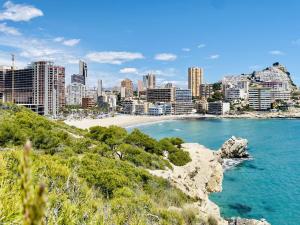 a view of a beach with a city in the background at A531 - Calasol - 2004 Finestrat s.l. in Cala de Finestrat