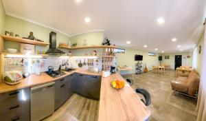 a kitchen with a wooden counter top in a room at Belmonte Kazbegi in Kazbegi