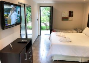 
Una cama o camas en una habitación de Windmuhle Apart Hotel & Spa
