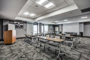 a classroom with tables and chairs in a room at Hyatt Place Fort Worth / Cityview in Fort Worth