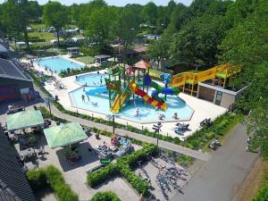 an aerial view of a water park with two pools at Chalet Mariënberg in Mariënberg