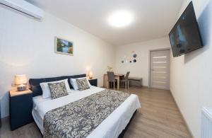 Ліжко або ліжка в номері Apartments Riviera