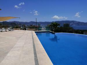 Bazén v ubytování Sun Set Acapulco nebo v jeho okolí