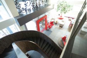 an overhead view of a spiral staircase in a building at Kalya Hotel Bandung Dago in Bandung