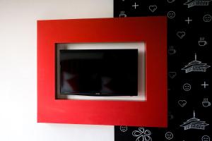 TV in/ali zabaviščno središče v nastanitvi Kalya Hotel Bandung Dago