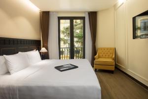 Postel nebo postele na pokoji v ubytování Hotel Sapa Square Affiliated by Melia